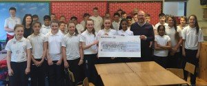 Sixth Class pupils presenting the cheque to Ballinrobe Town Hall Treasurer, Sean O'Connell.